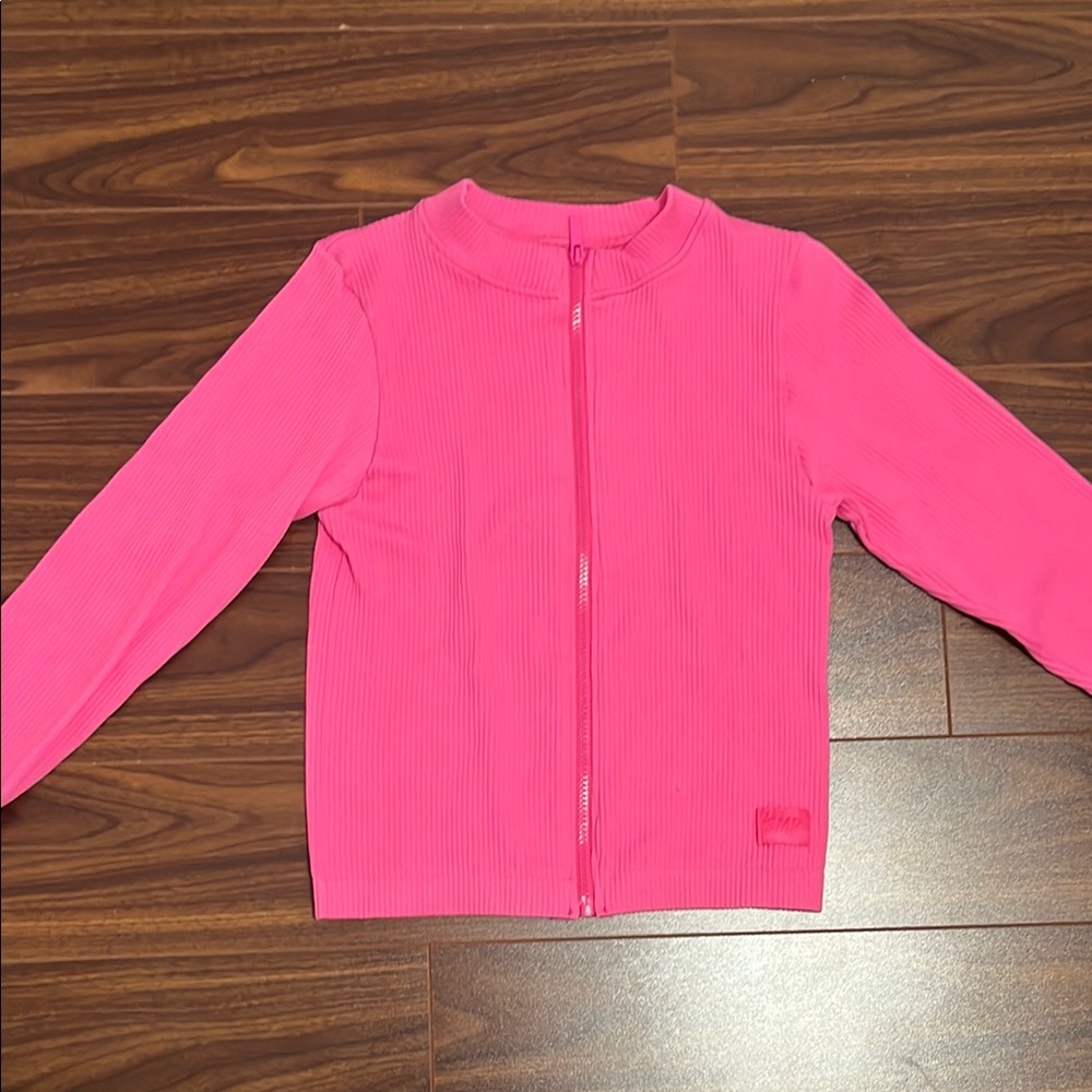 Pink define jacket zip up, fits like a small and is kinda cropped